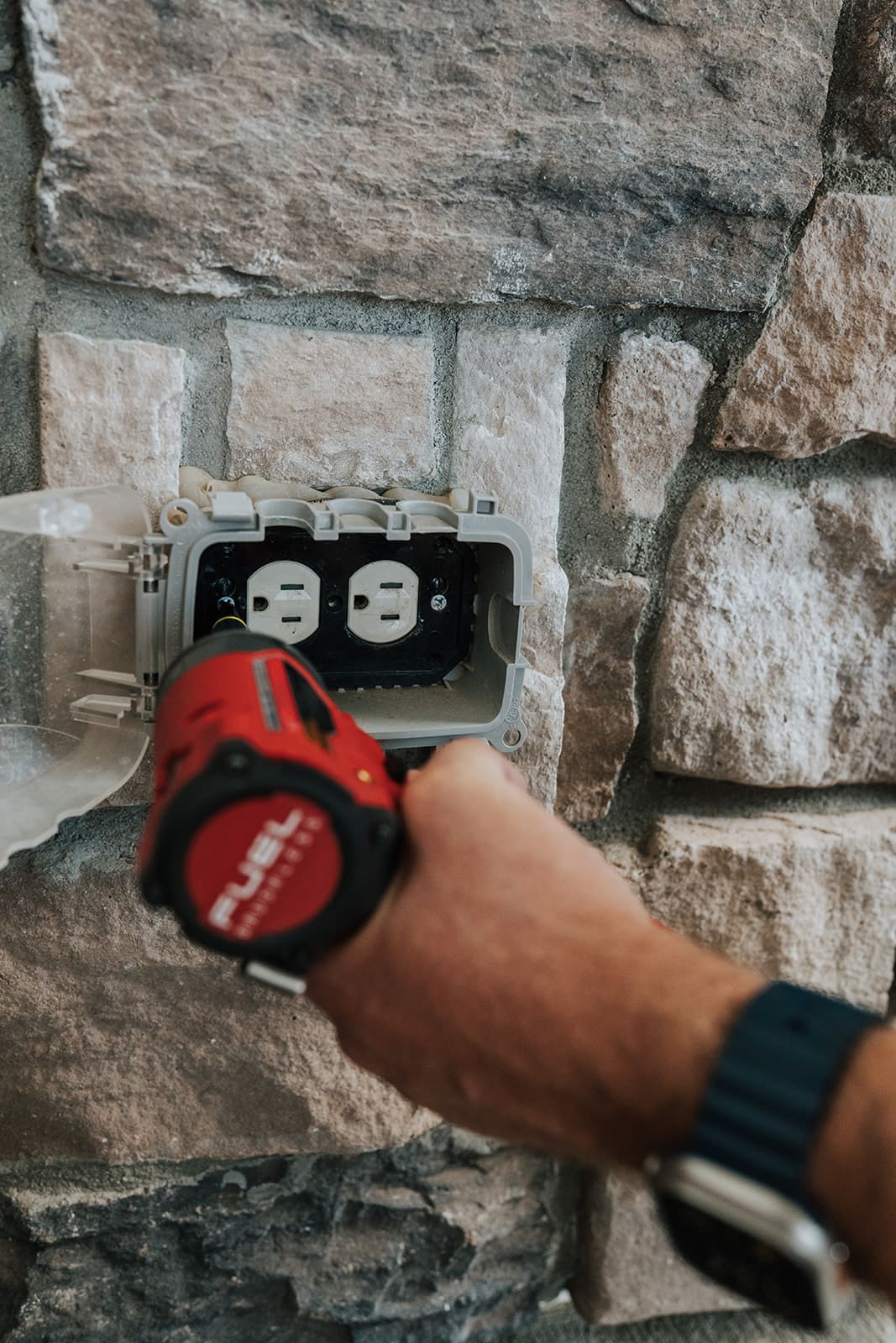 Weatherproof duplex outlets being installed outdoors