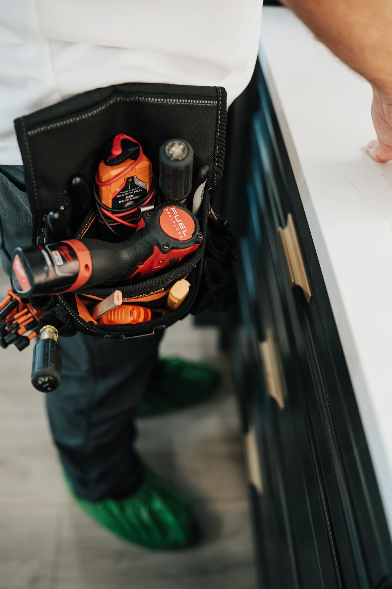 An Allsafe Electric tool bag set down on a kitchen counter at the start of a job